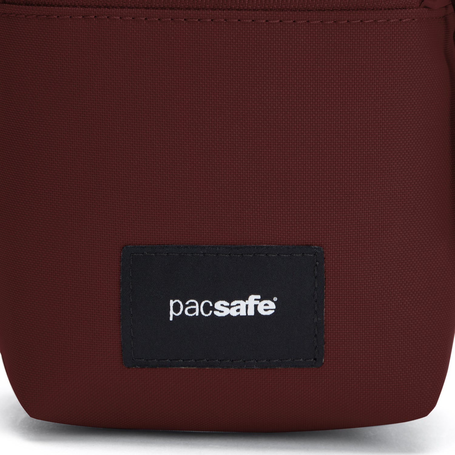 Product image of Pacsafe® GO Anti-Theft Micro Crossbody Pacsafe® GO anti-theft micro crossbody, Garnet Red